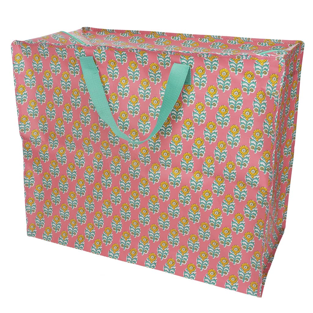 Floral-patterned storage box with green handles on a white background
