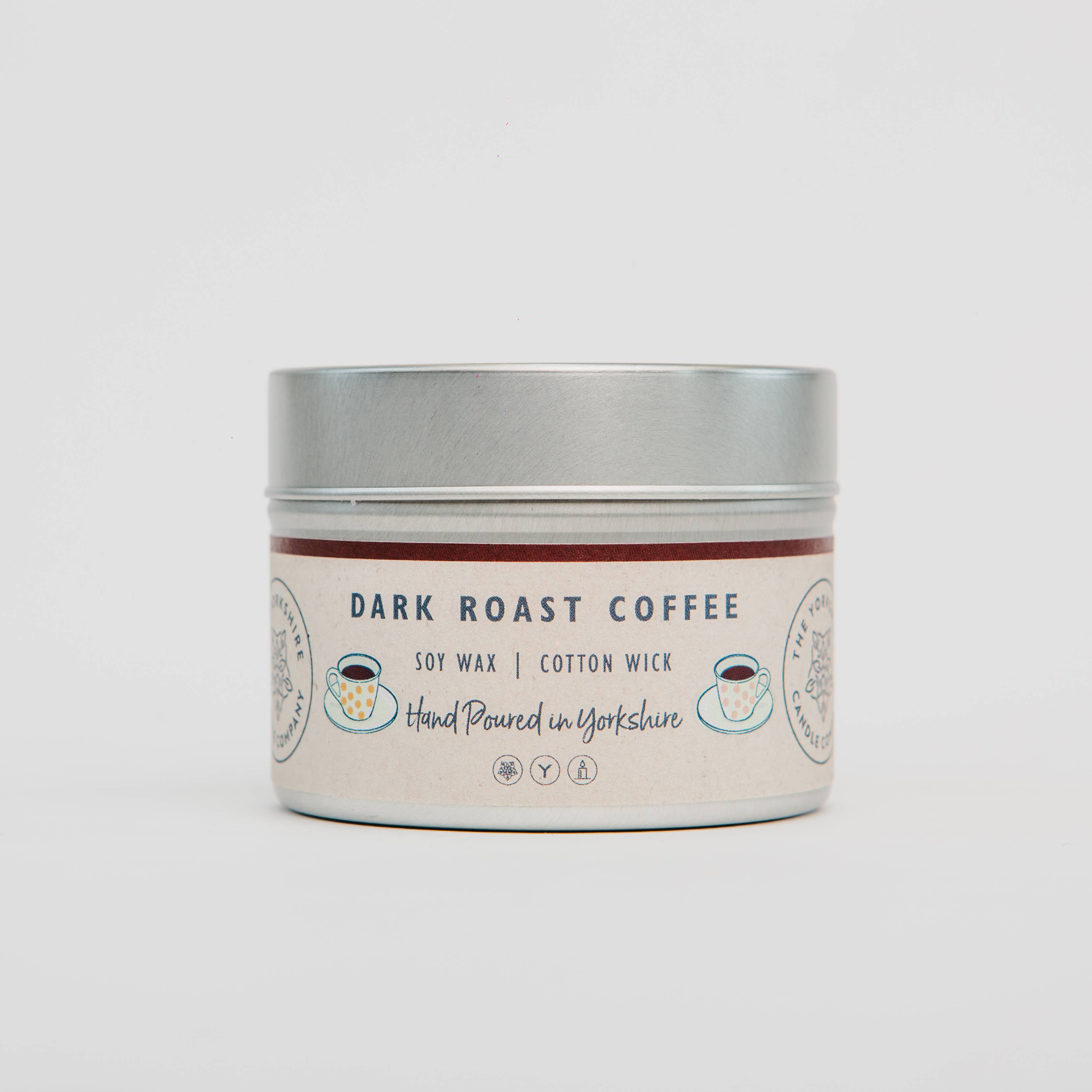 Candle in a tin labeled 'Dark Roast Coffee' on a white background
