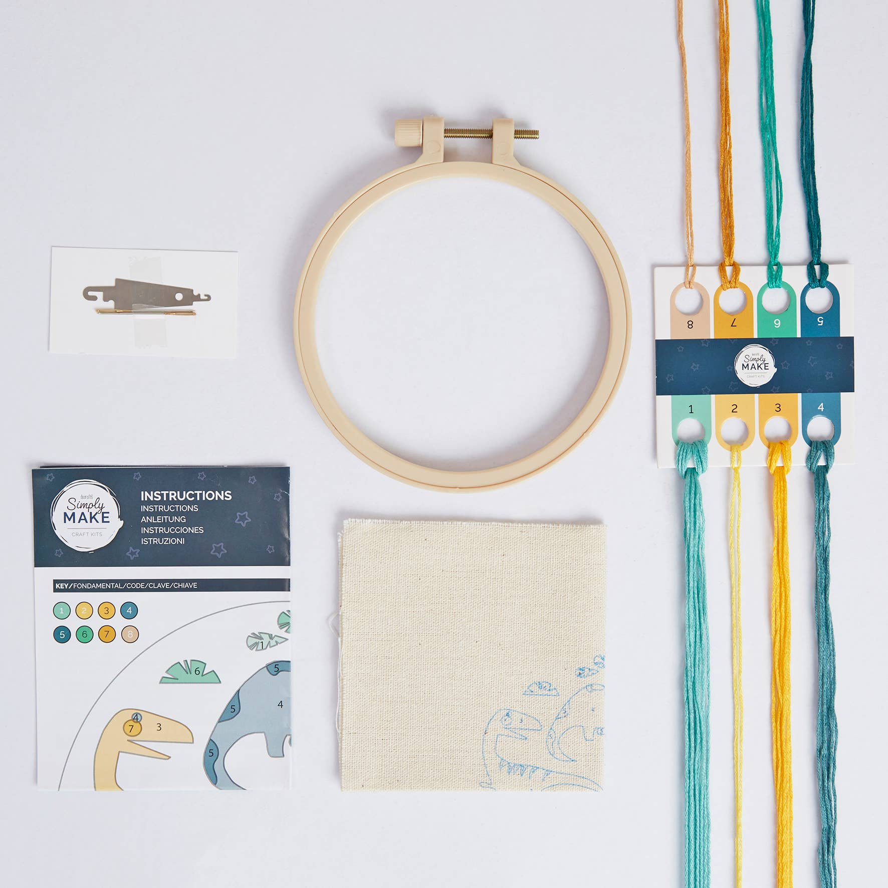 Embroidery hoop, fabric, thread, and instructions on a white background