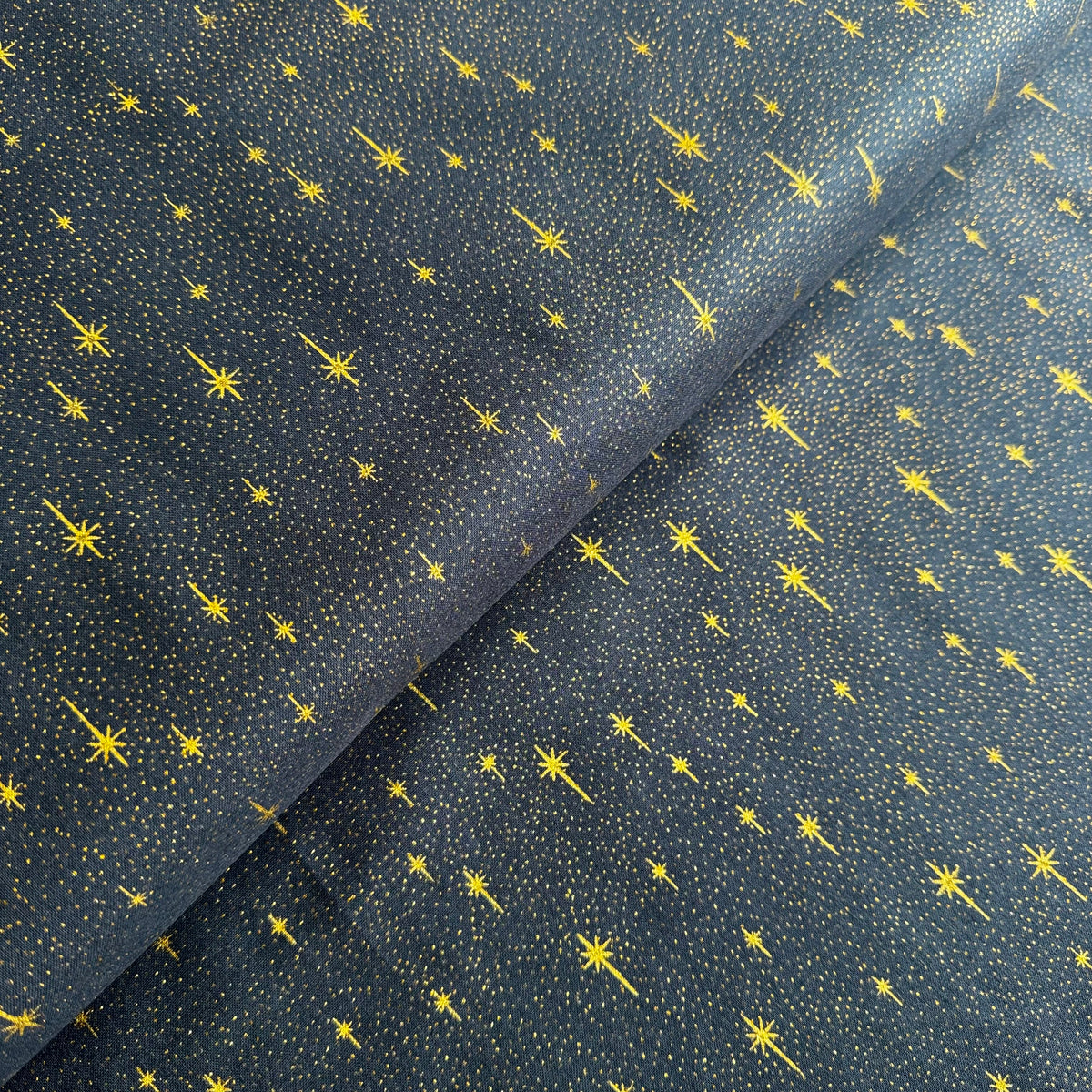 John Louden Christmas Stars on Navy Cotton Fabric at Bibelot Leek