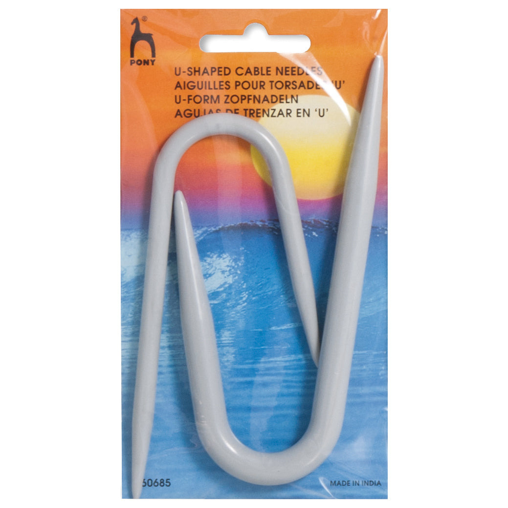 U-shaped cable needle in packaging with a colorful gradient background