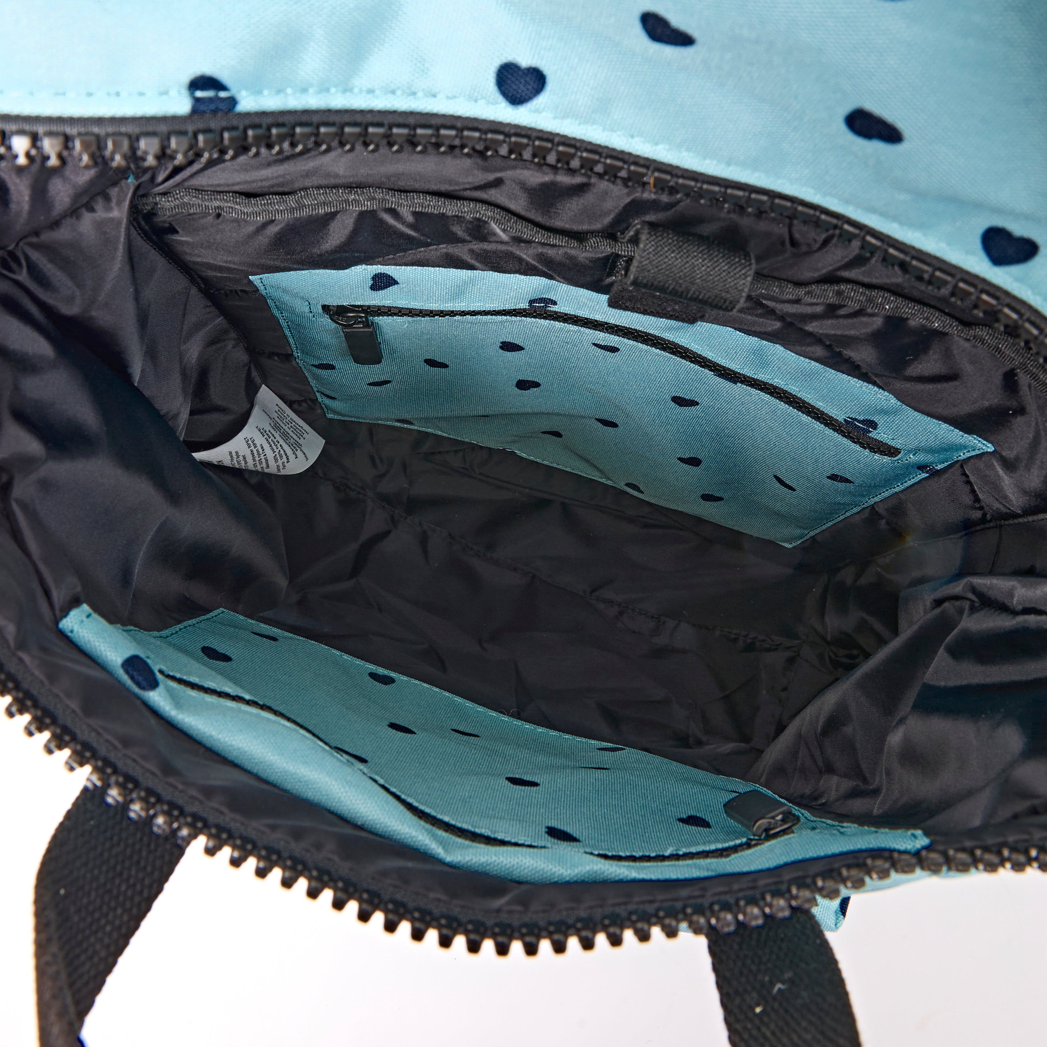 ROKA Canfield Roll Top Medium Backpack – Heart Print Recycled Canvas at Bibelot Leek UK Stockist