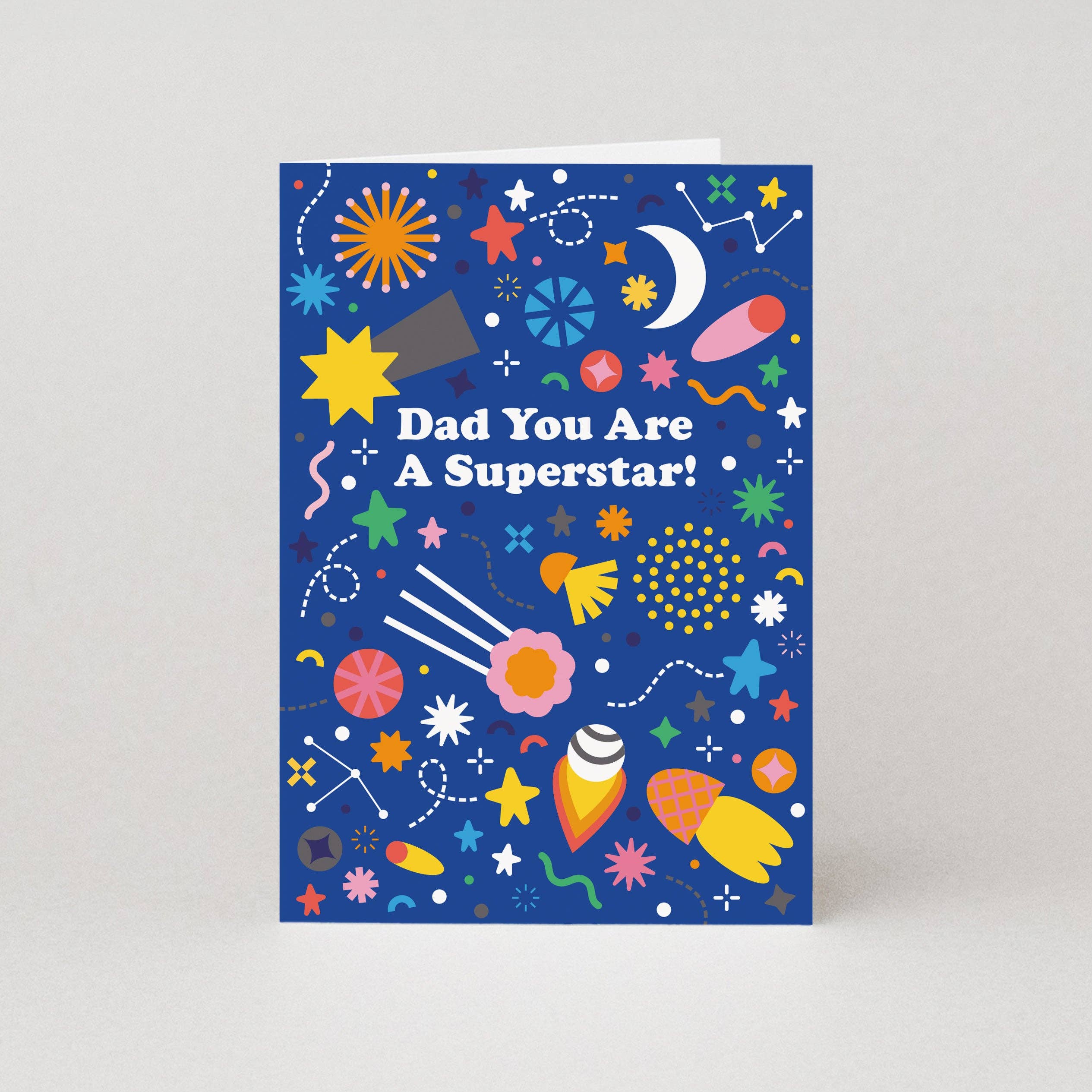 Greeting card with colorful space-themed illustrations and text on a blue background