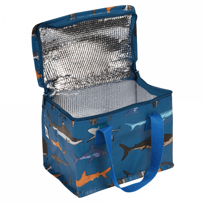 Blue insulated cooler bag with shark pattern on a green background