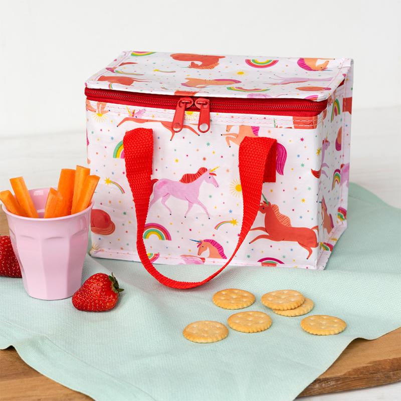 Children's lunch bag with unicorn design on a table with snacks