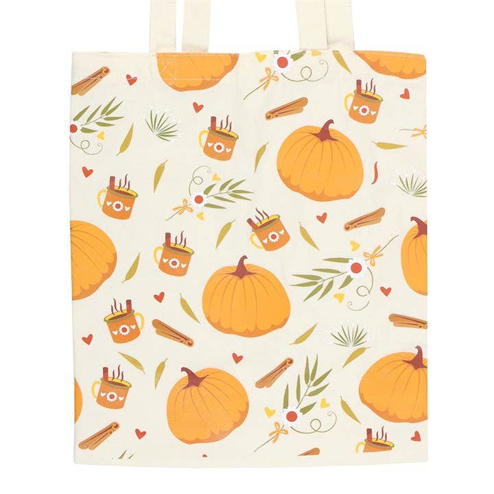Tote bag with autumn-themed pattern including pumpkins, leaves, and mugs on a beige background