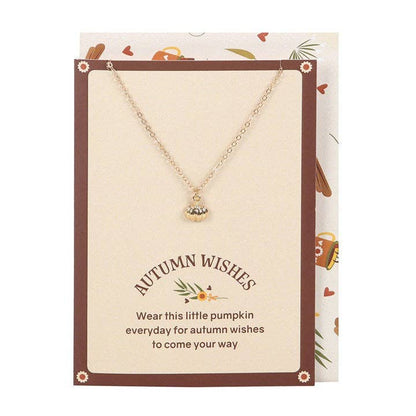 Necklace with pumpkin charm on an 'Autumn Wishes' card