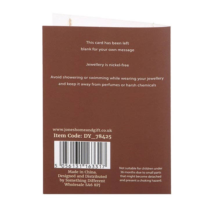 Back of a product packaging with text and a barcode on a brown background