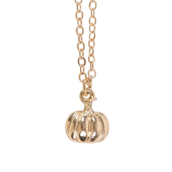 Gold pumpkin pendant necklace on a white background