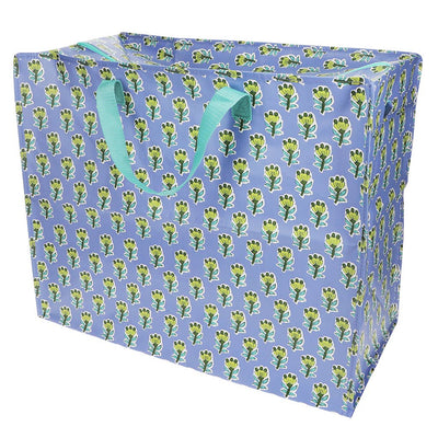 Blue storage box with green floral pattern and handle on a white background