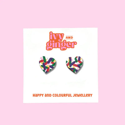 Heart-shaped earrings with colorful design on a card with 'ivy and ginger' branding.