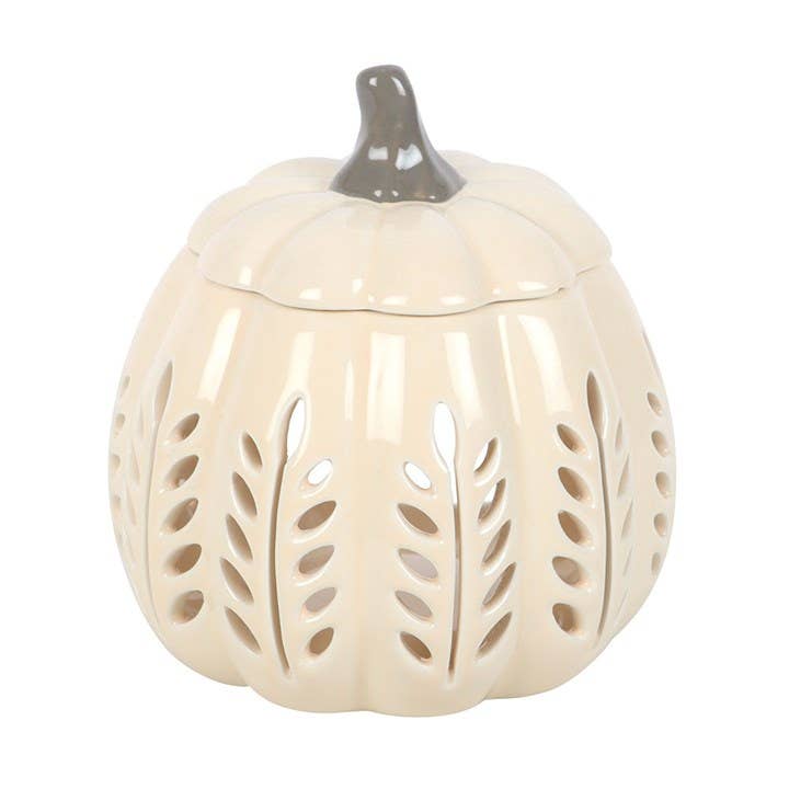 Ceramic pumpkin-shaped lantern with leaf patterns on a white background