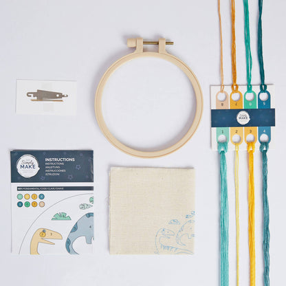 Embroidery hoop, fabric, thread, and instructions on a white background