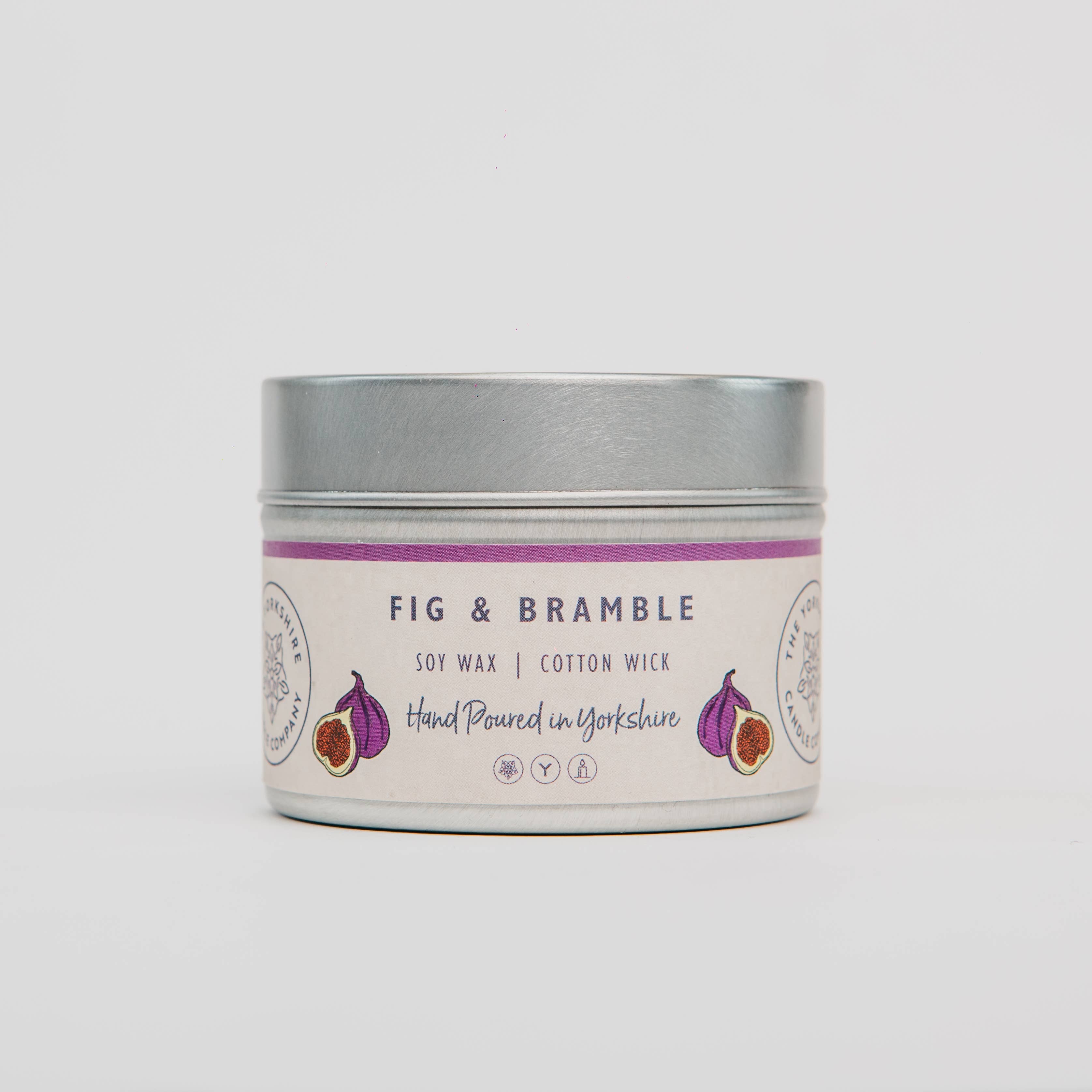 Candle in a tin with 'Fig & Bramble' label on a white background