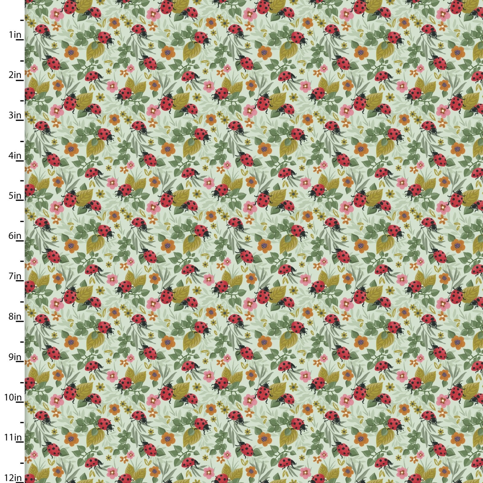 Floral patterned fabric with flowers and ladybugs on a green background