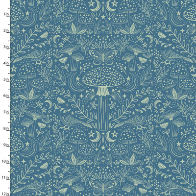 Fabric with nature-themed pattern including mushrooms, leaves, and butterflies on a blue background.