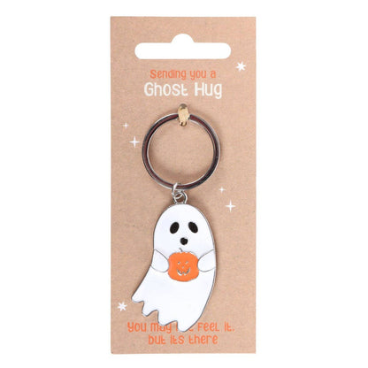 Ghost-shaped keychain on a brown card with text