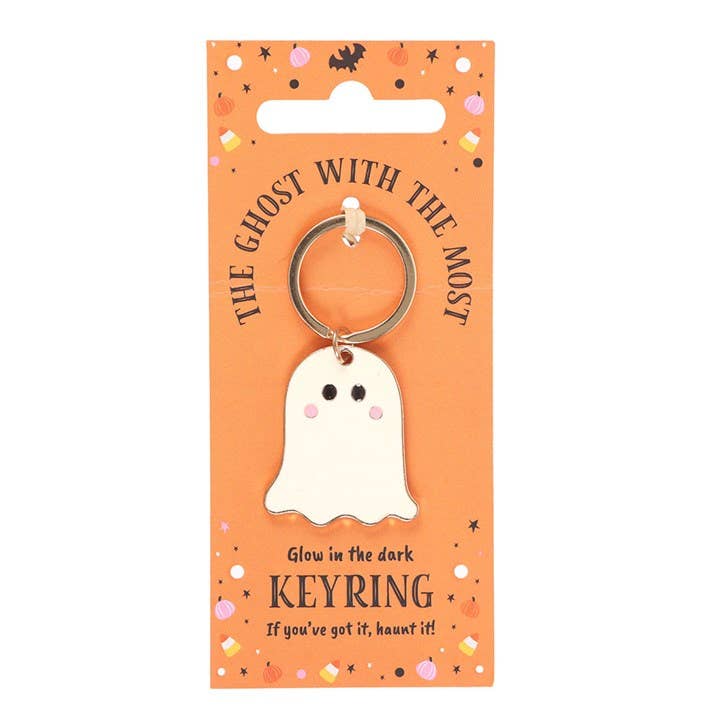 Glow-in-the-dark ghost keyring on an orange packaging with text