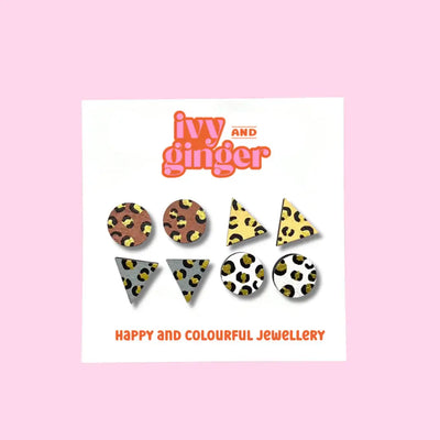 Jewelry set with leopard print patterns on a pink background, featuring the brand 'ivy and ginger'.