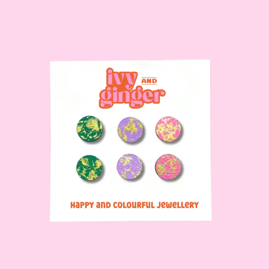 Set of colorful earrings on a card with 'ivy and ginger' branding on a pink background