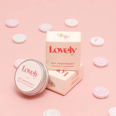 Lovely candy lip balm packaging on a pink background