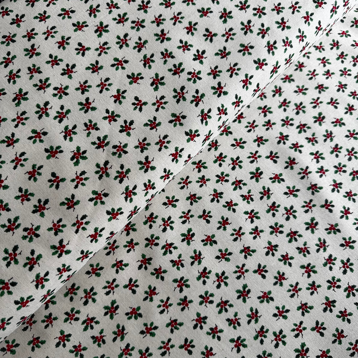 John Louden Christmas Holly on Cream Cotton Fabric at Bibelot Leek