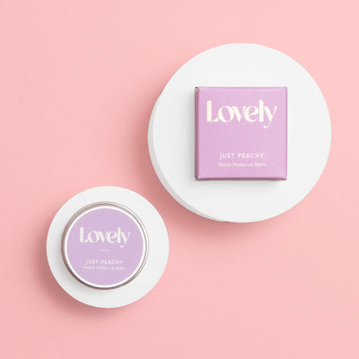 Lovely brand lip balm on a pink background