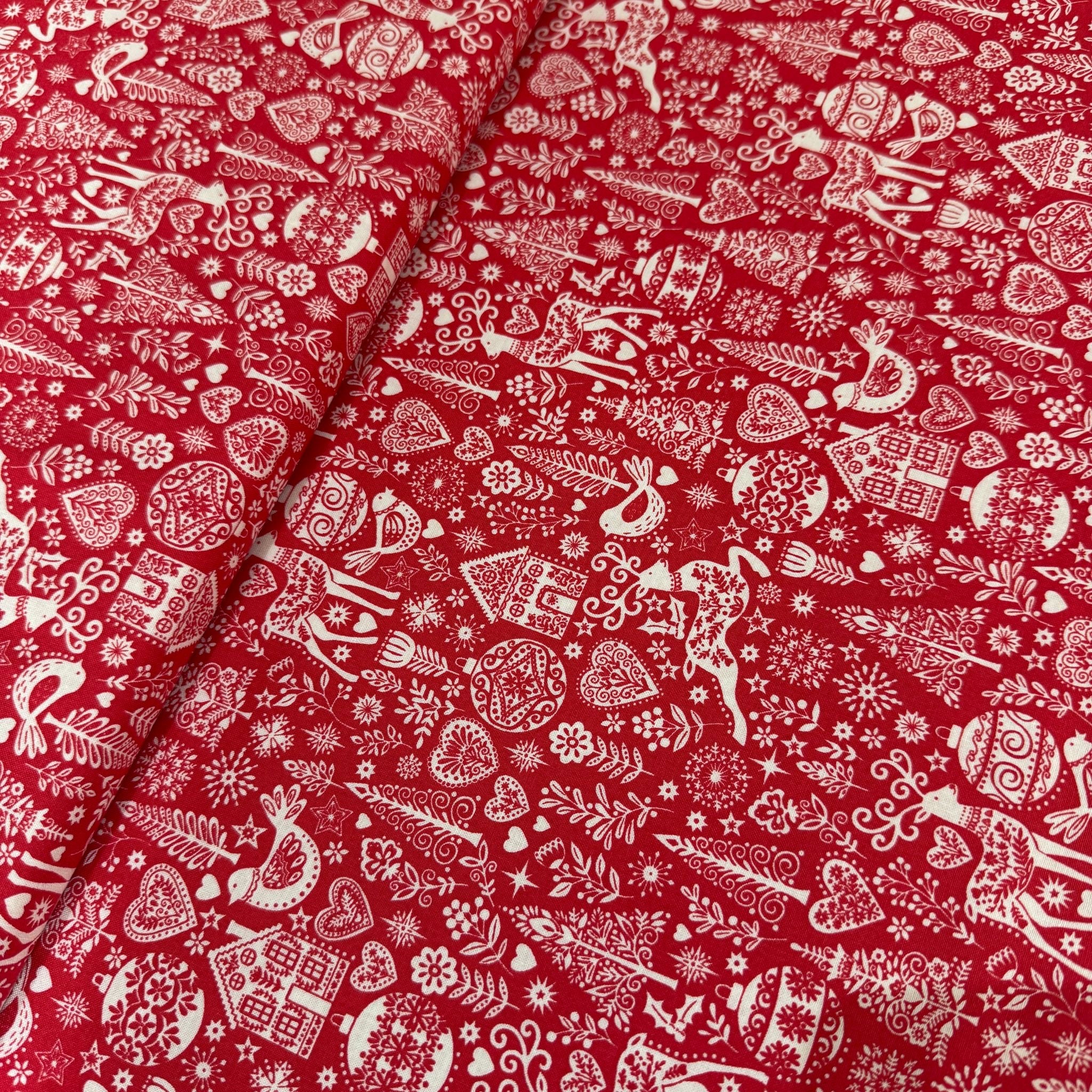 Red fabric with white pattern of horses and floral designs