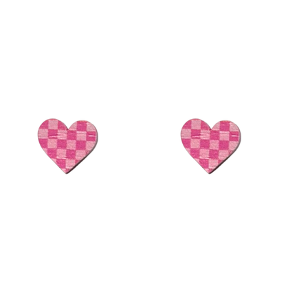 Pair of pink checkered heart-shaped earrings on a white background