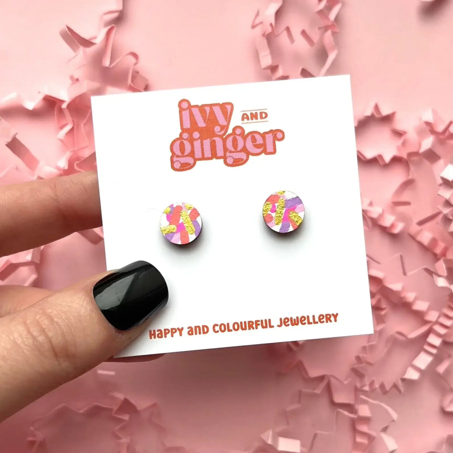 Ivy and Ginger earrings on a card with pink confetti background