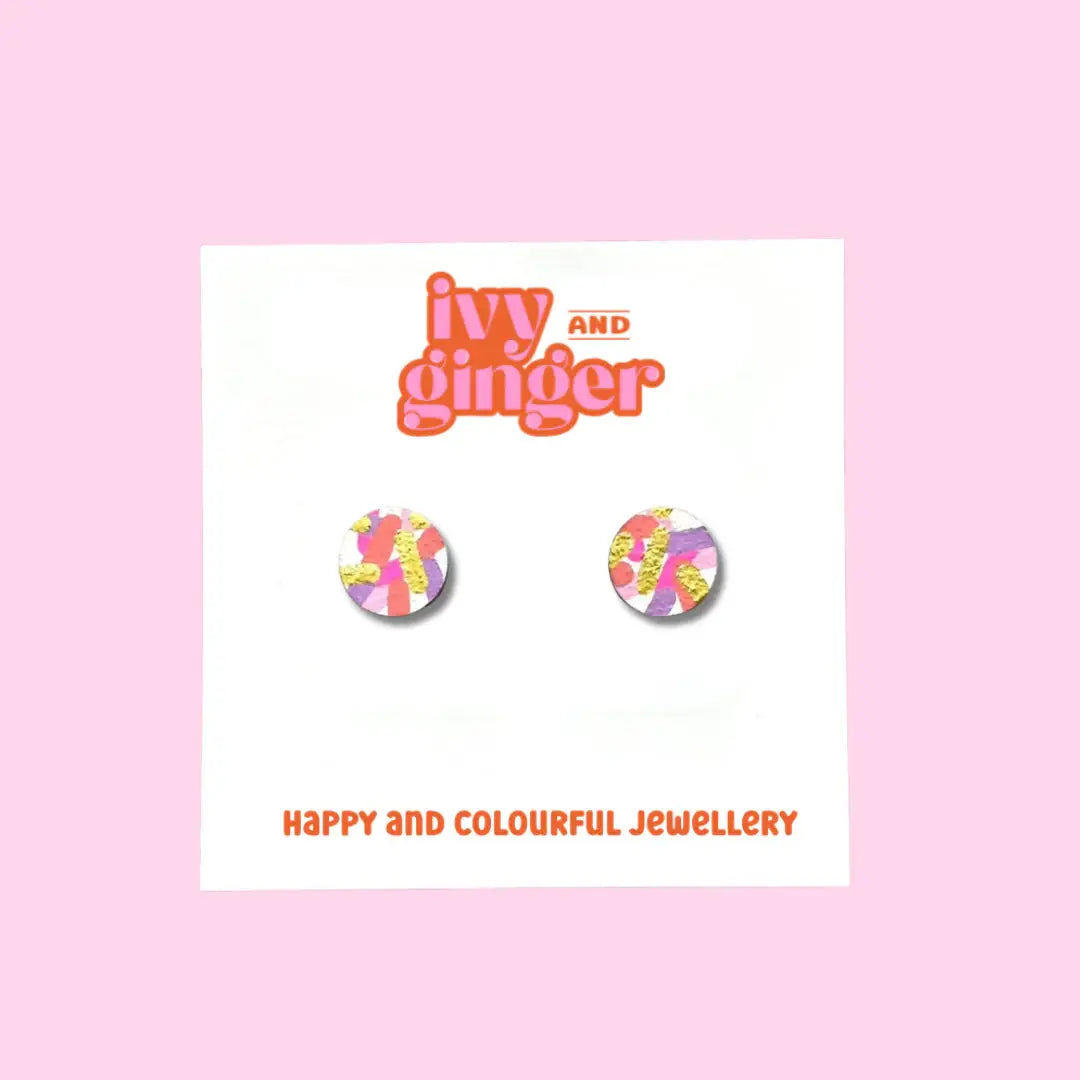 Earring packaging with 'ivy and ginger' branding on a pink background