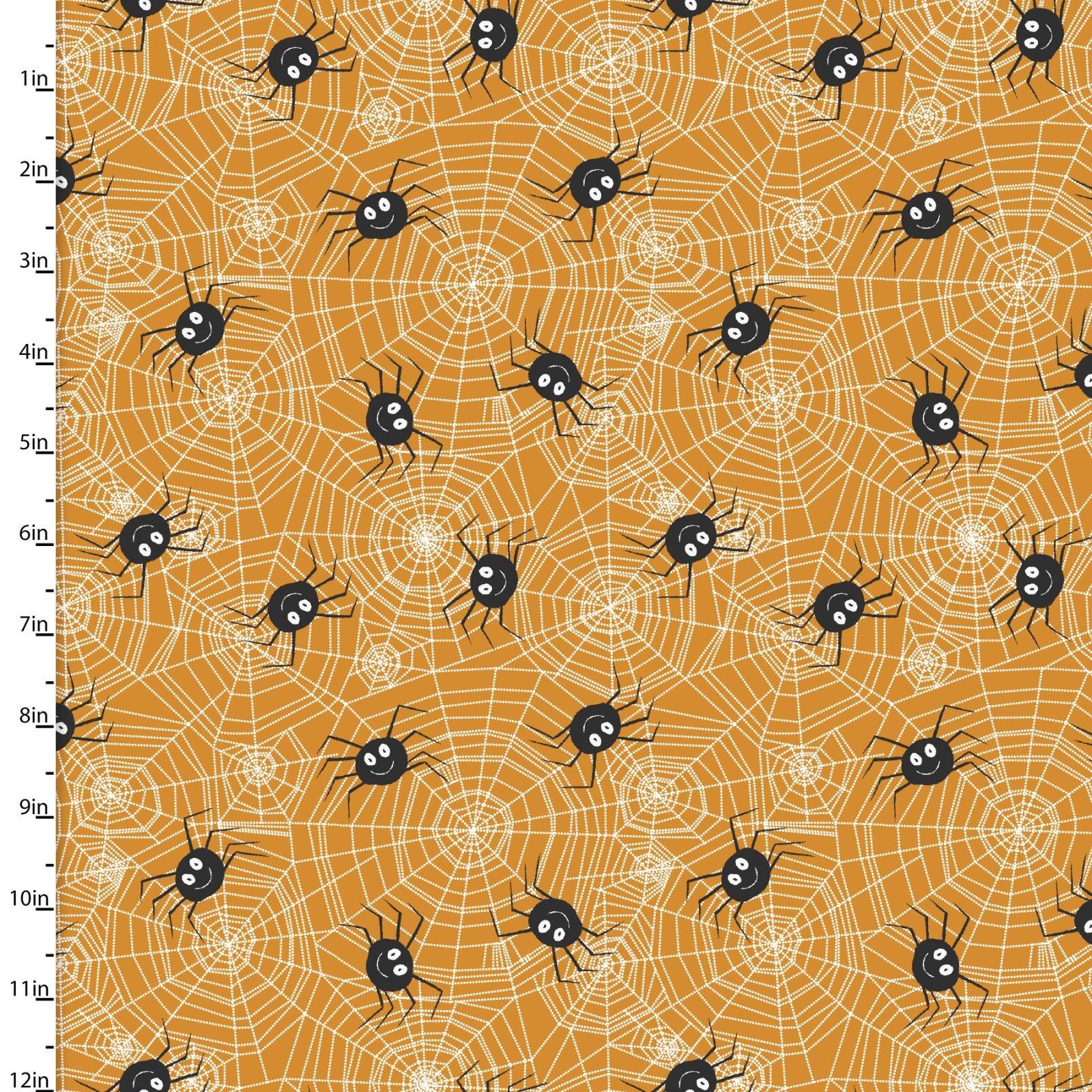 Fabric with spider and web pattern on an orange background, measured in inches.