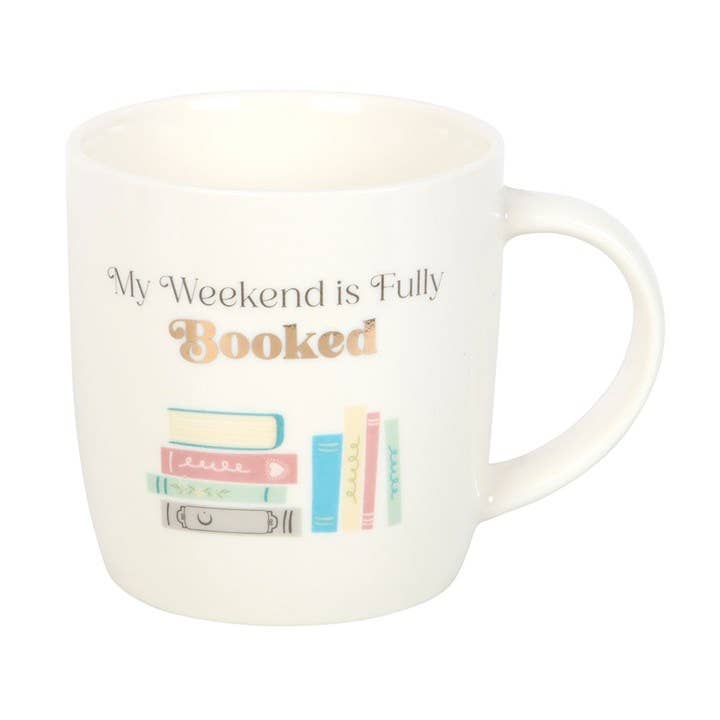 White mug with 'My Weekend is Fully Booked' text and book illustrations on a white background