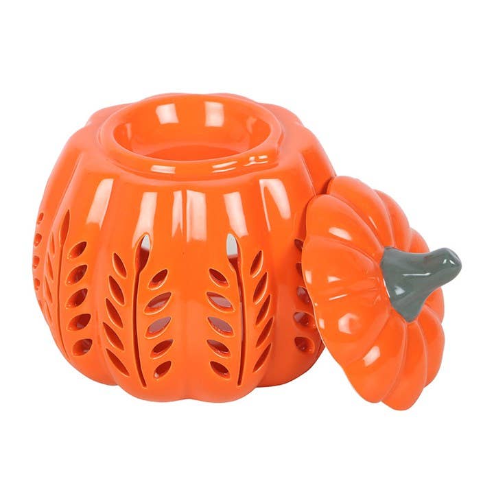 Orange ceramic pumpkin with a lid on a white background