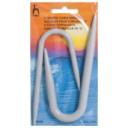 U-shaped cable needle in packaging with a colorful gradient background