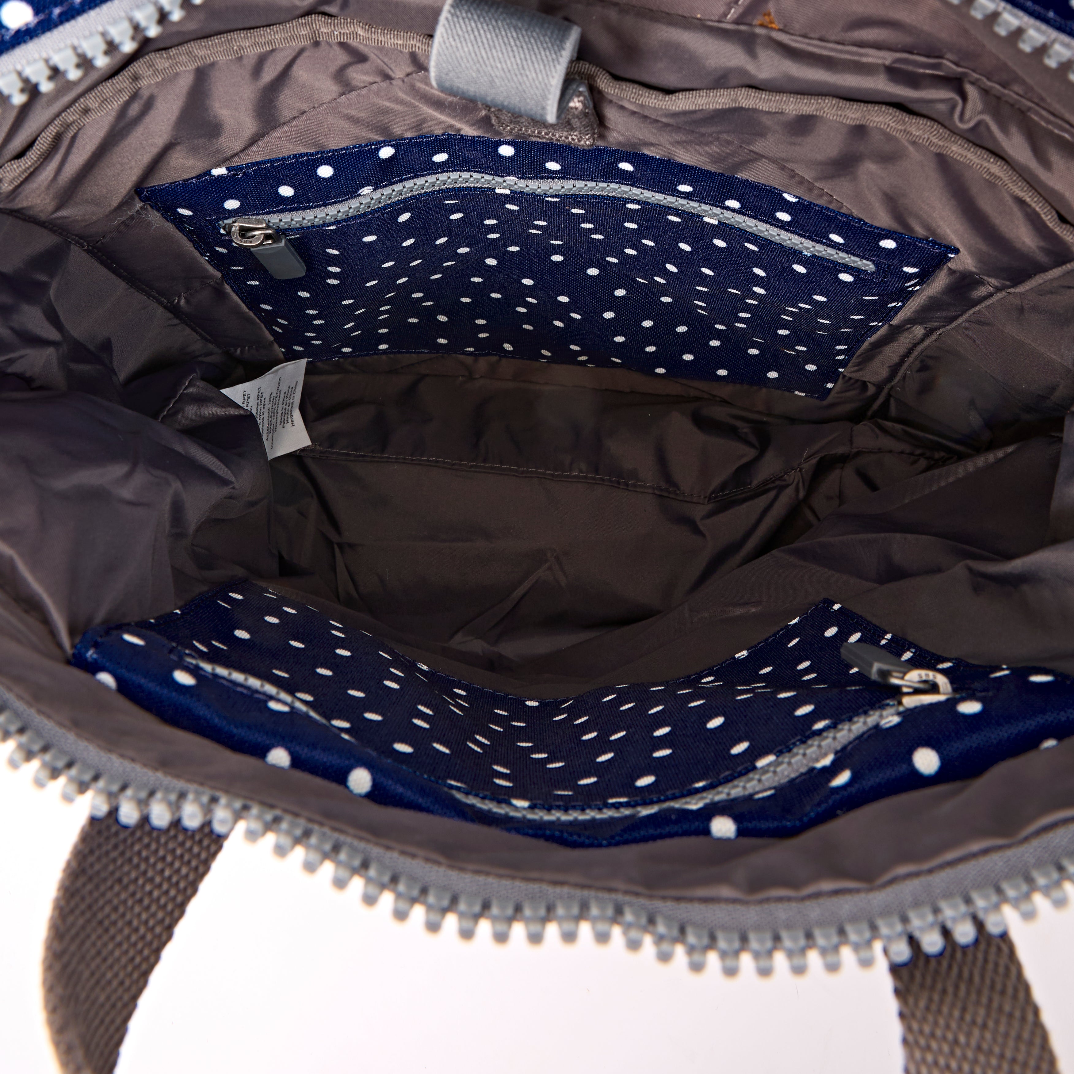 ROKA Canfield Roll Top Medium Backpack – Navy Polka Dot Recycled Canvas at Bibelot Leek UK Stockist