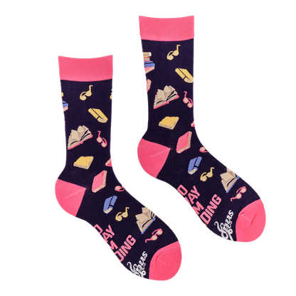 Pair of socks with book and music note pattern on a white background