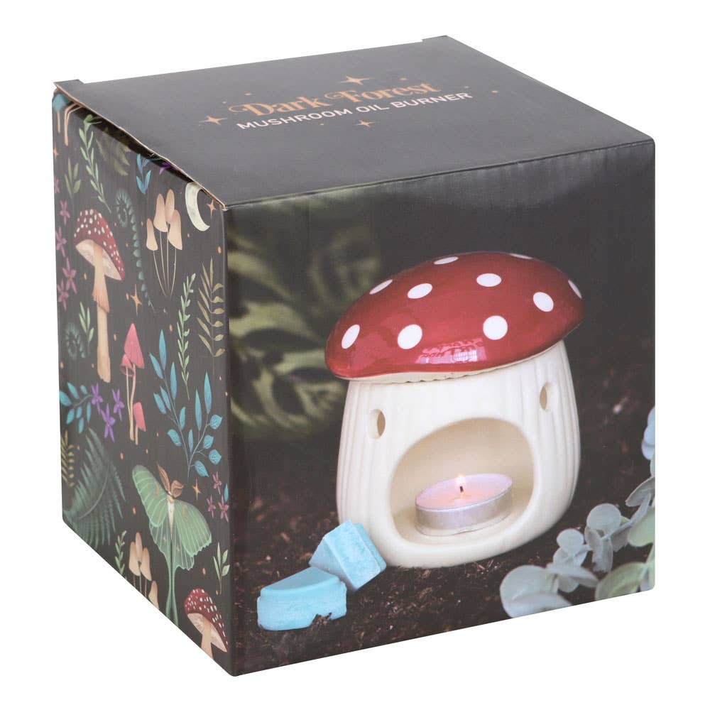 Mushroom-shaped oil burner in packaging with forest design