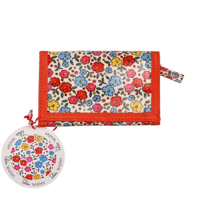 Floral-patterned wallet with matching round cardholder on a white background