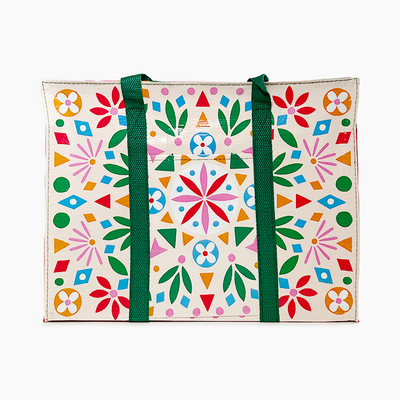 blue Q Colorful patterned tote bag with green straps on a white background