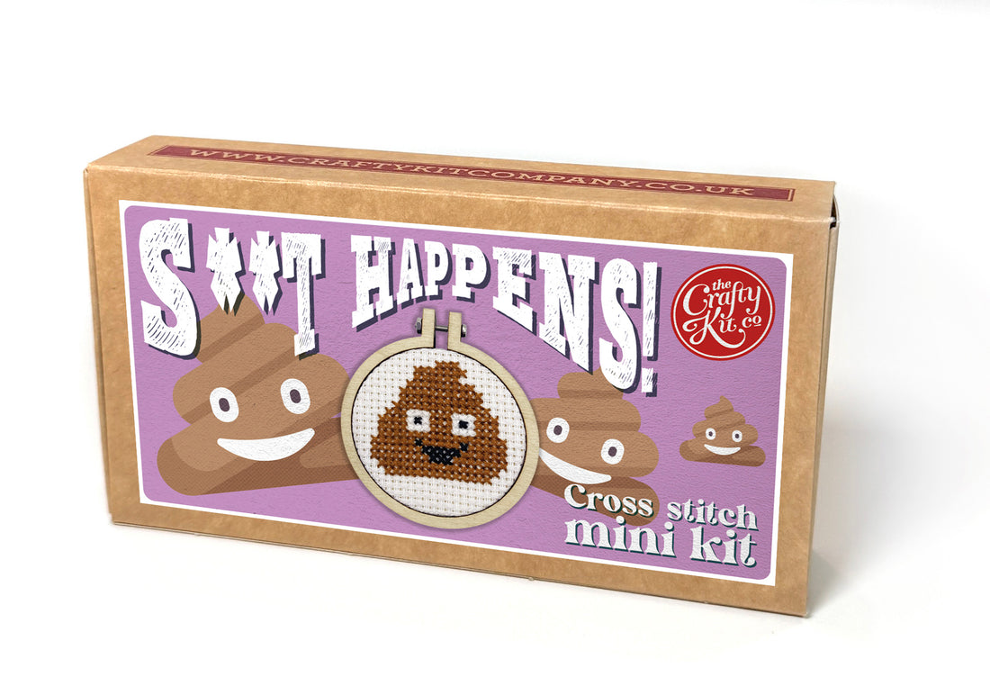 Cross stitch mini kit box with poop emoji design on a white background