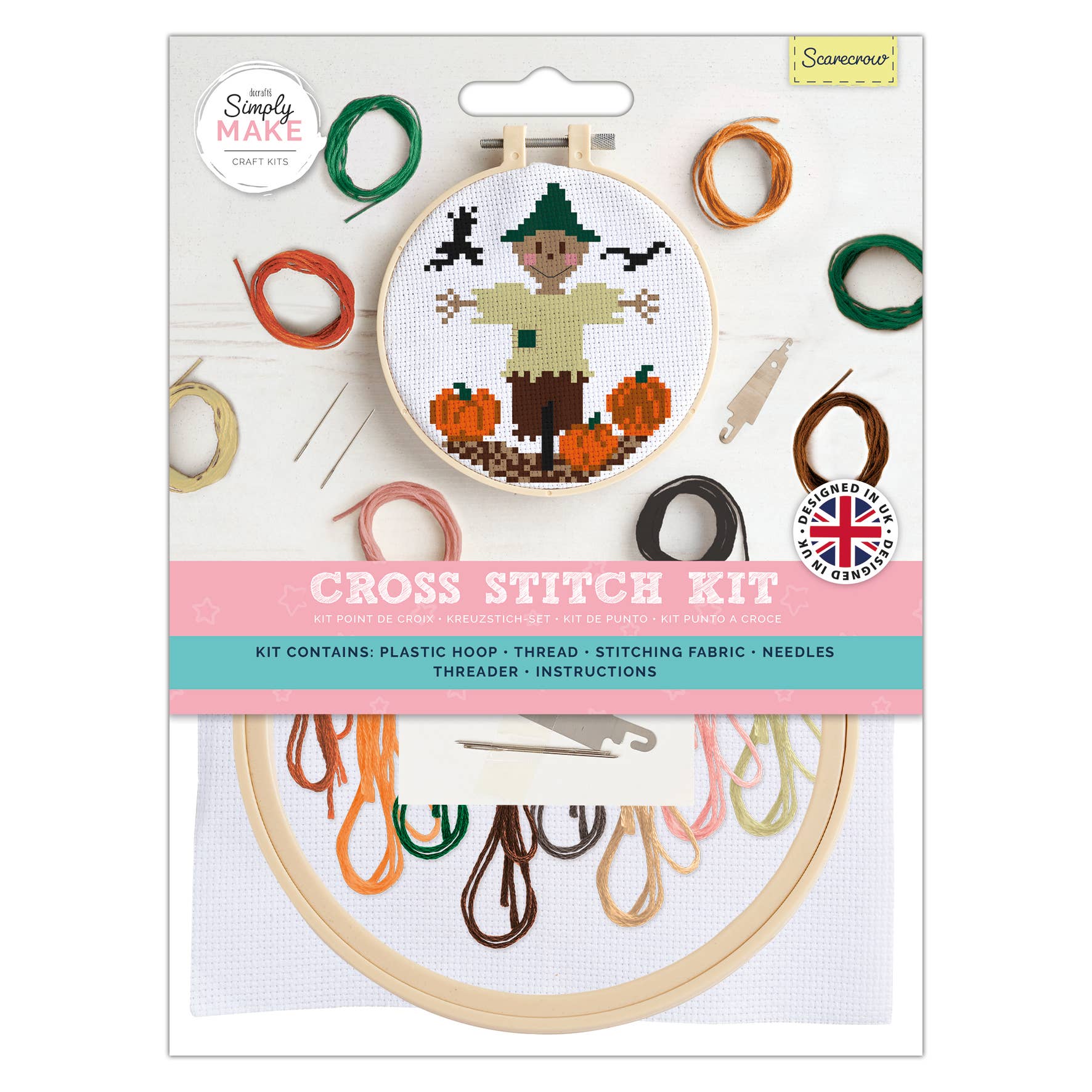 Cross stitch kit packaging with embroidery hoop and thread colors on a white background