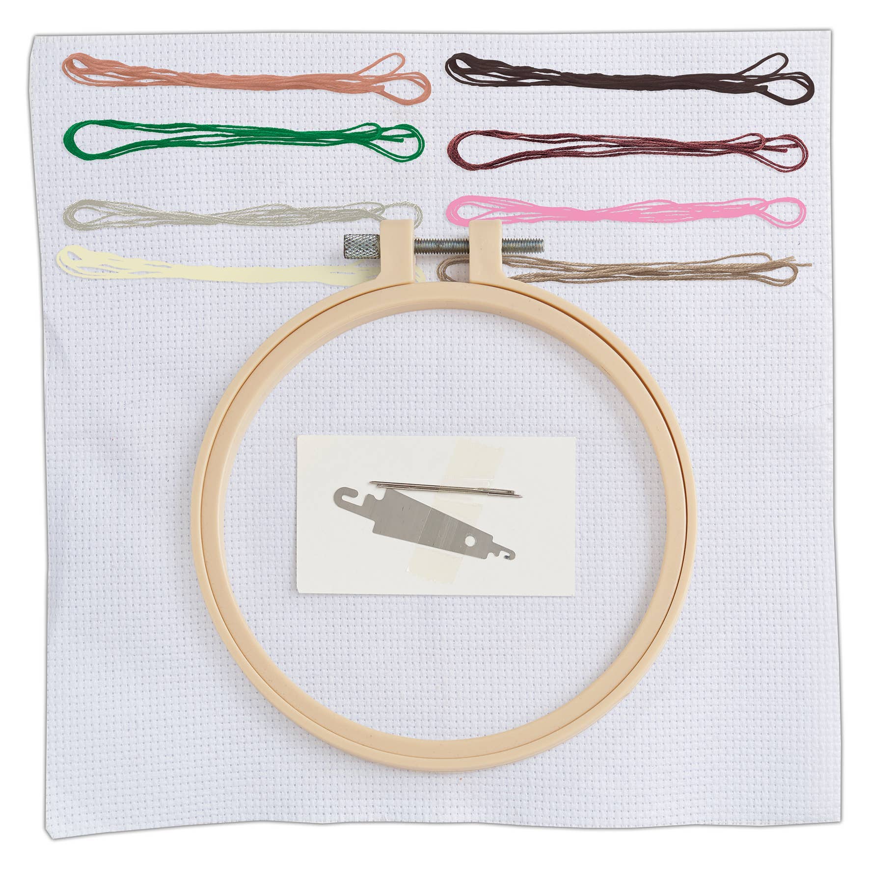 Embroidery hoop with colorful threads and a small tool on a white background