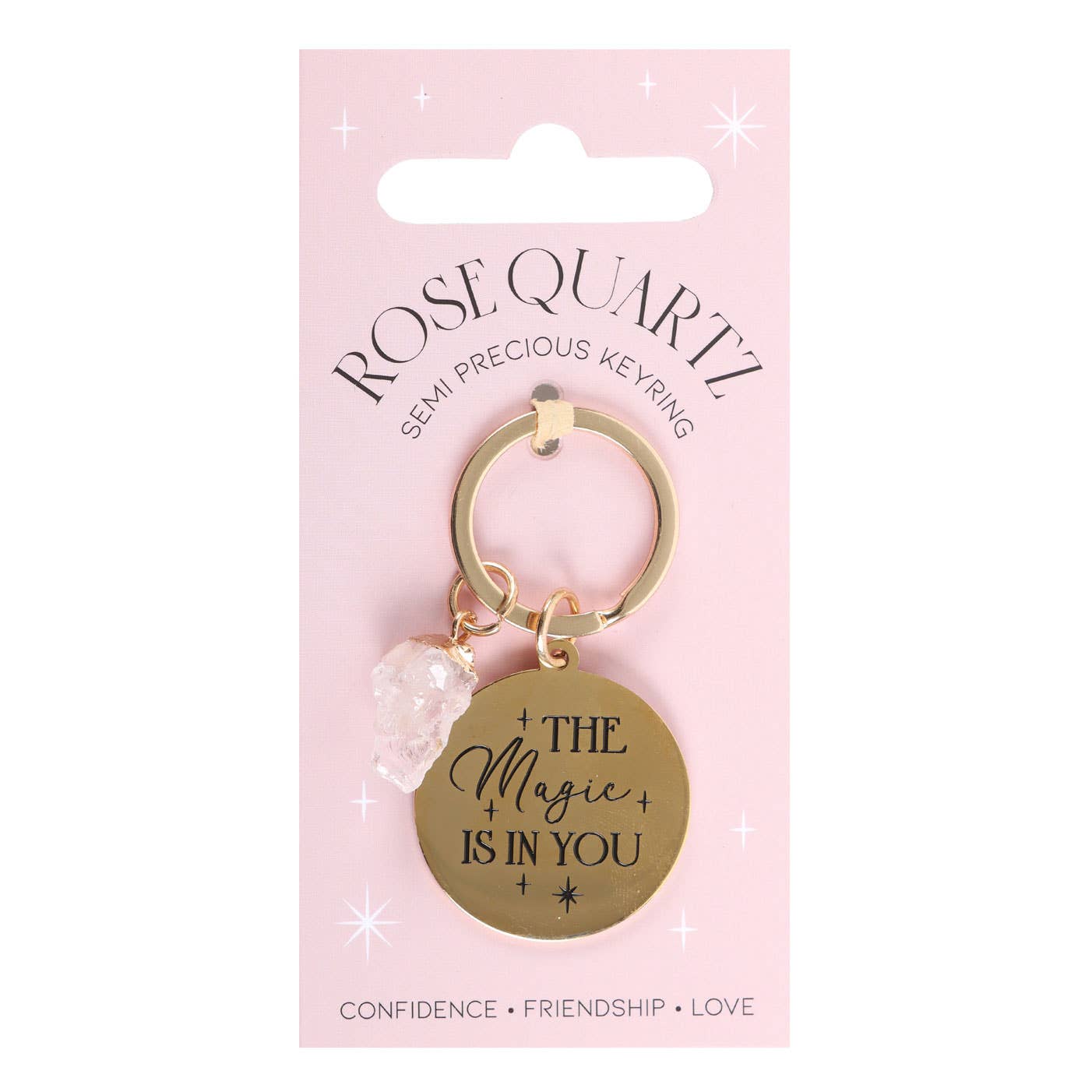 Keychain with 'The Magic is in You' tag on a pink packaging background