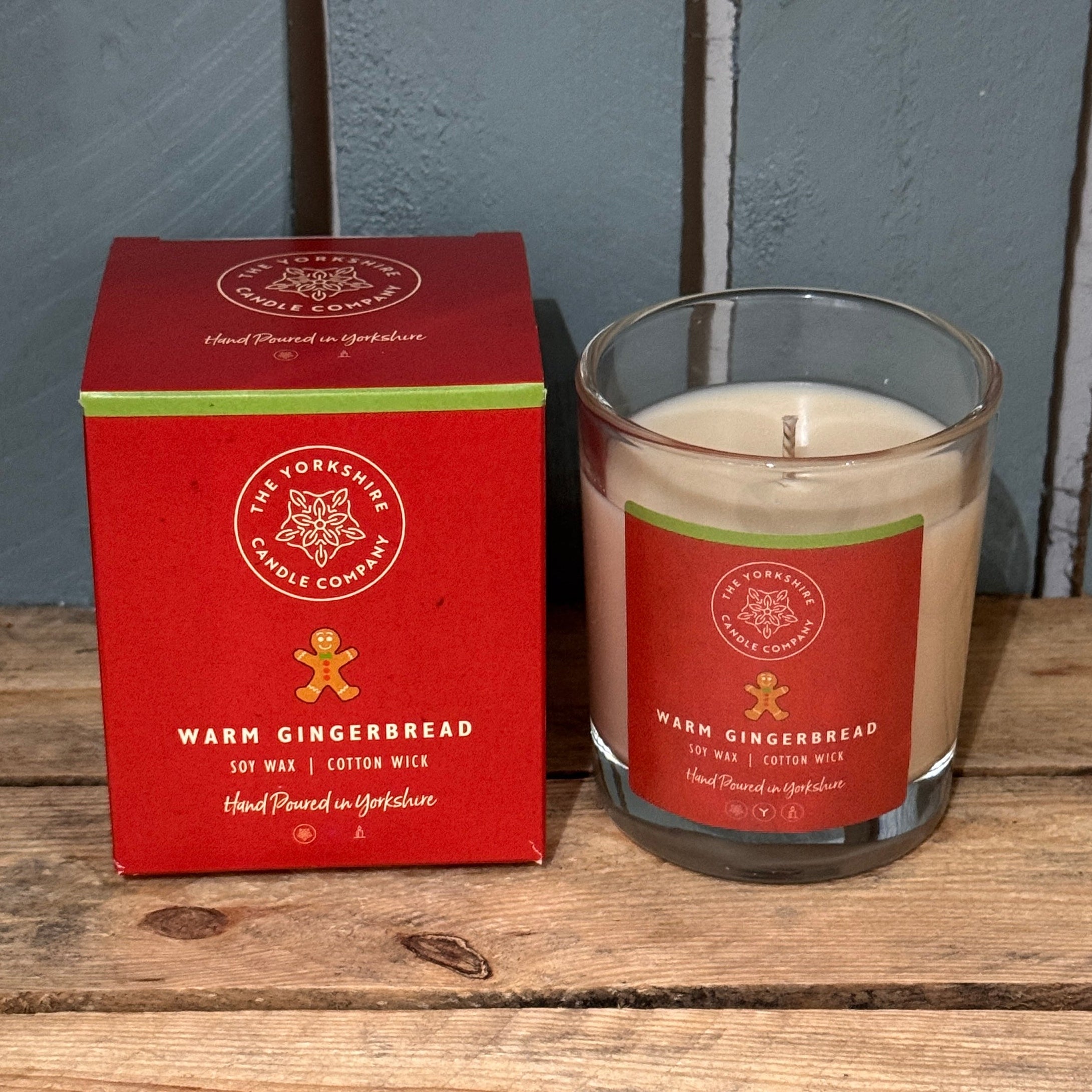Yorkshire Candle Company Warm Gingerbread candle and packaging on a wooden surface.