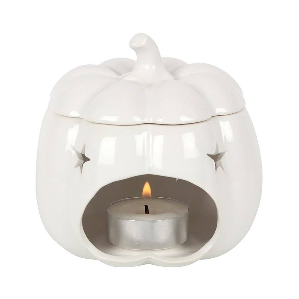 White ceramic oil burner with a lit tealight candle on a white background