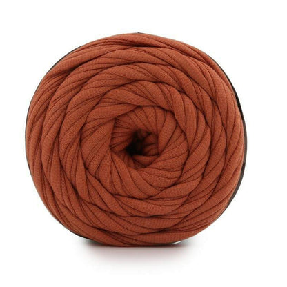 Brown yarn ball on a white background