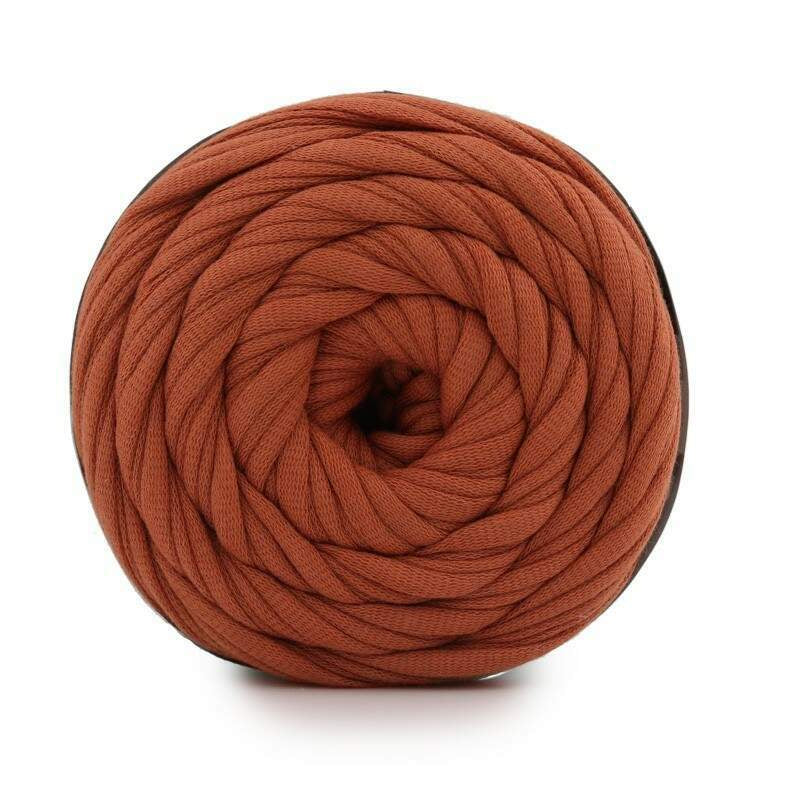 Brown yarn ball on a white background