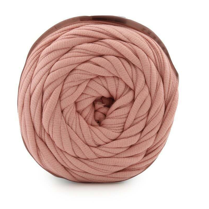 Ball of pink yarn on a white background