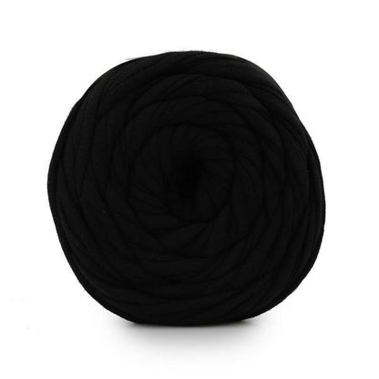 Black yarn ball on a white background